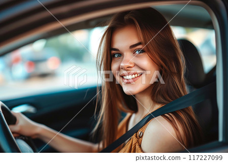 Glamorous Girl Enjoying the Drive in Colorful Dress 117227099
