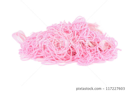A bunch of beautiful pink beads on a fishing line over a white background. 117227603
