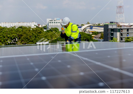 Engineer working setup Solar panel at the roof top. Engineer working setup Solar panel at the roof top. 117227613