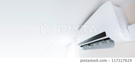 Air conditioner on white wall room interior 117227629