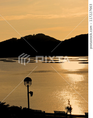 Sunset over the sea 117227663