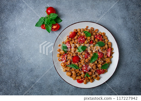 Tuscan pasta with smoked paprika and basil,parmesan cheese, Italian traditional cuisine, Tuscan pasta with smoked paprika and basil,parmesan cheese, Italian traditional cuisine, 117227942