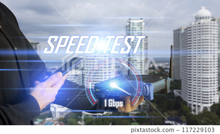Super Fast internet connection speedtest bandwidth network technology, Man using Internet high speed by smartphone and laptop computer, 5G quality, speed optimization. Super Fast internet connection speedtest bandwidth network technology, Man using Internet high speed by smartphone and laptop computer, 5G quality, speed optimization. 117229103