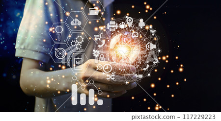 Man holding light bulb, new idea with AI technology, innovation and creativity. Get creative with glowing light bulbs. 117229223