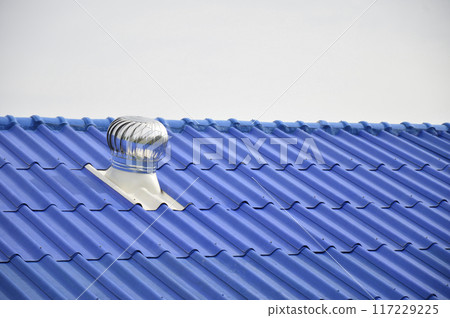 The blue roof is equipped with a wind turbine to ventilate the cooling air on the roof. The blue roof is equipped with a wind turbine to ventilate the cooling air on the roof. 117229225