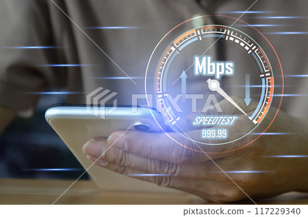 fast internet connection speedtest network bandwidth technology Man using high speed internet with smartphone and laptop computer. 5G quality, speed optimization. fast internet connection speedtest network bandwidth technology Man using high speed internet with smartphone and laptop computer. 5G quality, speed optimization. 117229340