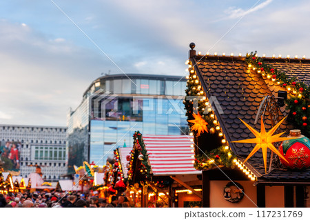 Beautiful traditional German Christmas Market square in city center many carousel Christmas tree light and decoration. Christmas and new year celebration season. Advent festive New year fair 117231769