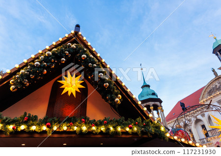 Beautiful traditional German Christmas Market square in city center many carousel Christmas tree light and decoration. Christmas and new year celebration season. Advent festive New year fair 117231930