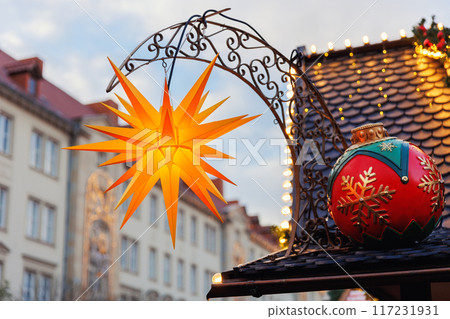 Beautiful traditional German Christmas Market square in city center many carousel Christmas tree light and decoration. Christmas and new year celebration season. Advent festive New year fair 117231931