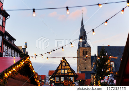 Charming Quedlinburg old traditional German Christmas Market square city center carousel Christmas tree light and decoration. Christmas and new year celebration season. Advent festive New year fair Charming Quedlinburg old traditional German Christmas Market square city center carousel Christmas tree light and decoration. Christmas and new year celebration season. Advent festive New year fair 117232555
