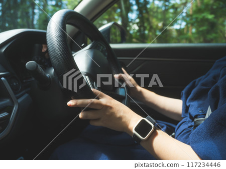 Woman driving a car Woman driving a car 117234446