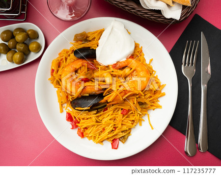 Pasta with seafood contains tiger prawns, shell mussels, spices and white sauce Pasta with seafood contains tiger prawns, shell mussels, spices and white sauce 117235777