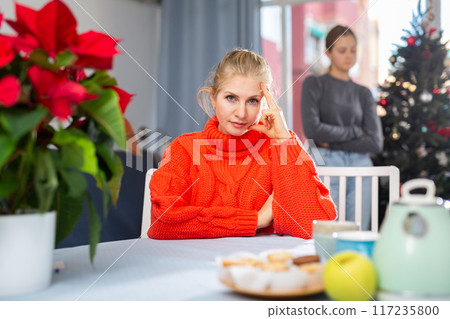 Upset adult woman ignoring her daughter 117235800