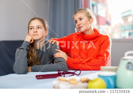 Sad teen girl after discord with her mother 117235816