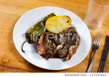 Fried fatty and juicy lamb and vegetable side dish of potato and bell pepper 117235823