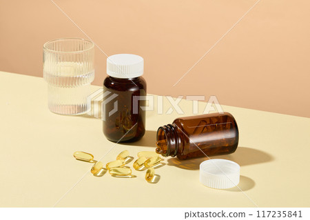 The promotional photo for nutritional supplements products, which used to improve the diet, contain vitamins, minerals, herbs or amino acids. High angle shot, mock up bottles for branding 117235841