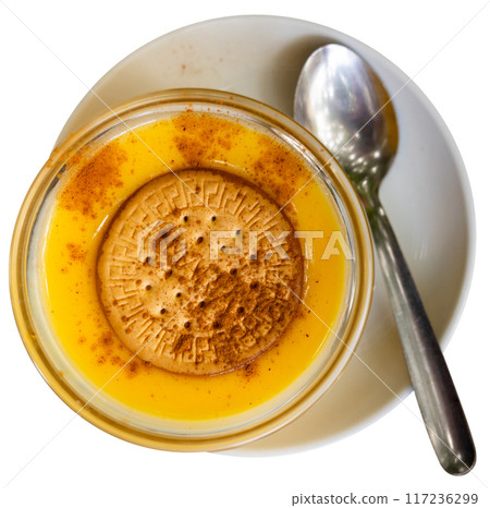 Delicate custard dessert made from milk, eggs and sugar, ornamented with soda biscuit. 117236299