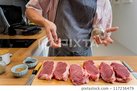 Raw fillet beef meat for steaks on the home electric grill 117236479