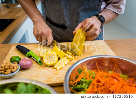 Chef at the kitchen preparing spicy glass noodle salad Chef at the kitchen preparing spicy glass noodle salad 117236510