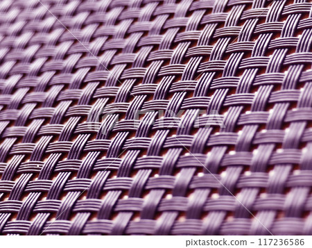 A closeup view of a wicker mat placed on a wooden table A closeup view of a wicker mat placed on a wooden table 117236586