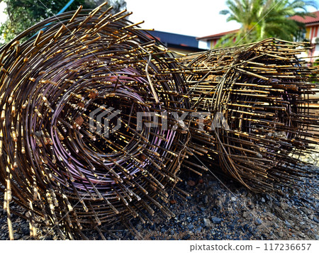 Metal bars arranged stack at the construction site 117236657
