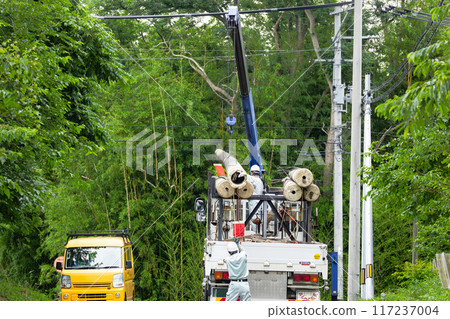 Outdoor electrical work: Loading electric poles for power transmission and distribution line work 117237004