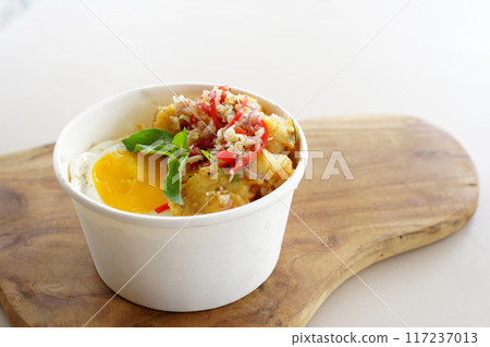 A bowl of food with meat and eggs A bowl of food with meat and eggs 117237013