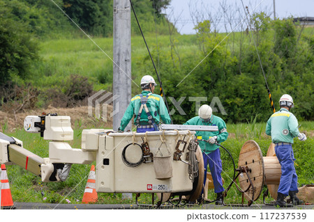 Electrical work: Power transmission and distribution line construction in progress 117237539