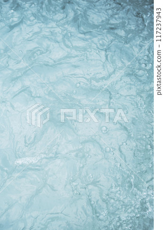 Turbulent water surface with visible foam and ripples. 117237943