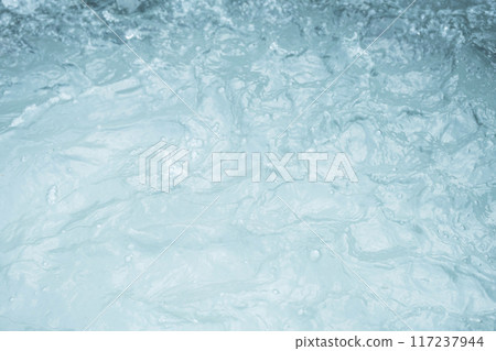 Turbulent water surface with visible foam and ripples. Turbulent water surface with visible foam and ripples. 117237944