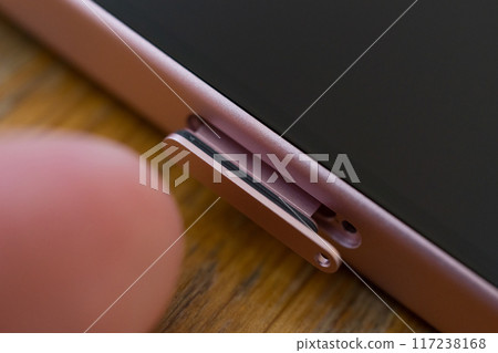 Open the SIM tray of your phone Open the SIM tray of your phone 117238168