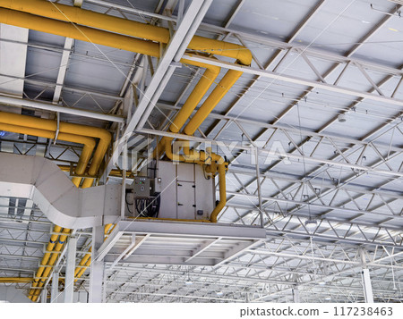 Ceiling with ventilation pipes and lights in industrial building Ceiling with ventilation pipes and lights in industrial building 117238463