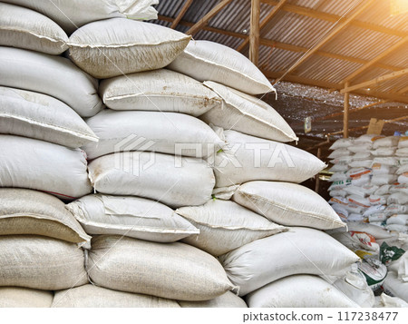 Stacking of big white bags in the modern warehouse 117238477