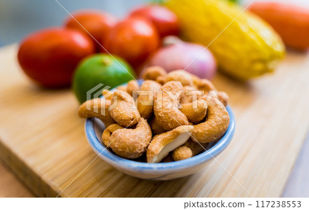 Cutting board with ingredients for preparing spicy glass noodle salad Cutting board with ingredients for preparing spicy glass noodle salad 117238553