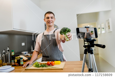 The chef is broadcasting live from workshop how to prepare a vegetarian food 117238609
