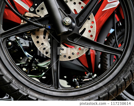 Detailed view of a motorcycle wheels and brakes Detailed view of a motorcycle wheels and brakes 117238614