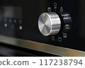 Oven knob controller with multi-function settings from side view 117238794