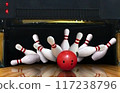 Bowling strike hit with ball hitting ten pins in the alley 117238796
