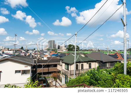 Looking toward the station from the east side of Tsutsujigaoka Station on the Keio Line, clear blue summer sky, Chofu City, Tokyo 117240305
