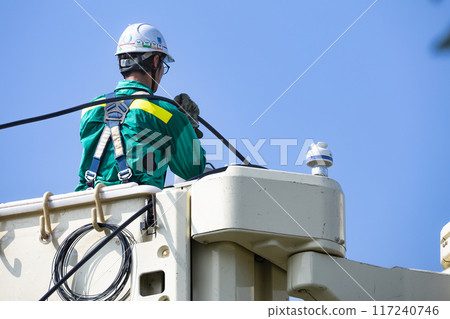 Electrical work: Power transmission and distribution line construction, high-altitude work in progress Electrical work: Power transmission and distribution line construction, high-altitude work in progress 117240746