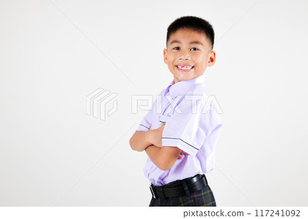 Portrait smiling Asian little boy primary posing with arms folded studio shot isolated white background, happy cute man kid wear school uniform crossed arms, back to school concept Portrait smiling Asian little boy primary posing with arms folded studio shot isolated white background, happy cute man kid wear school uniform crossed arms, back to school concept 117241092