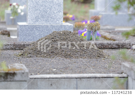 Grave incense holder pile of soil 117241238