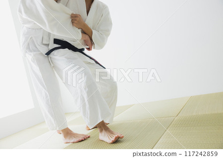 Man in judo uniform 117242859