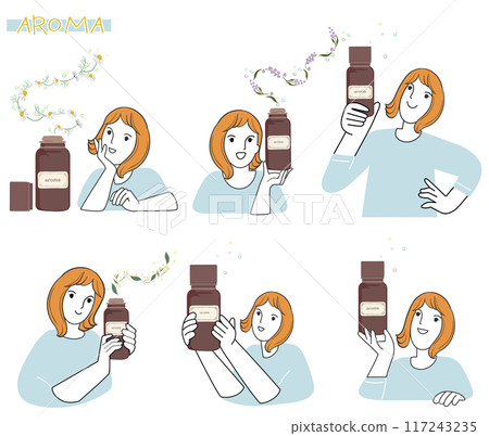 A woman holding essential oil in her hand and enjoying the aroma A woman holding essential oil in her hand and enjoying the aroma 117243235