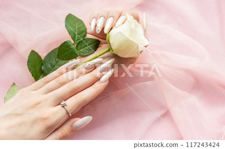 Female Hands with beautiful pearl manicure Female Hands with beautiful pearl manicure 117243424