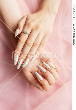 Female Hands with beautiful pearl manicure 117243425