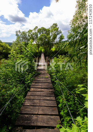 Suspension bridge, walkway to the adventurous, cross to the other side 117243650