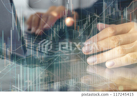 Close up shot of the woman with beautiful hands in the business attire, working on the laptop in the office, making notes 117245415