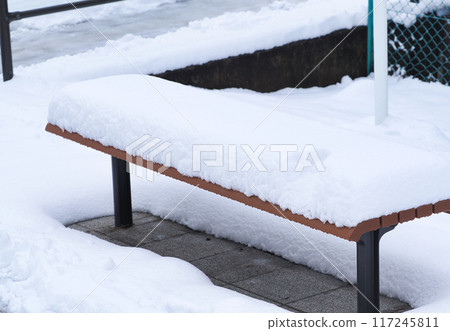 Bench buried in snow 117245811