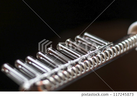 Close up shot of the high frequency comb tool for hair and scalp treatment. 117245873